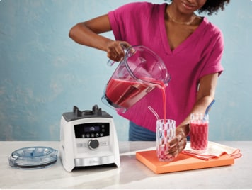 Image of Woman Pouring Smoothie in to Glass