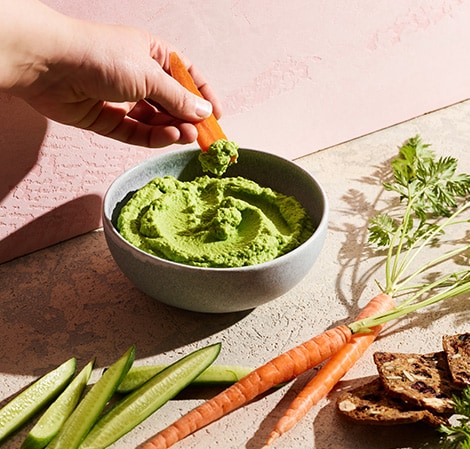 bowl of spinach and chive cauliflower hummus