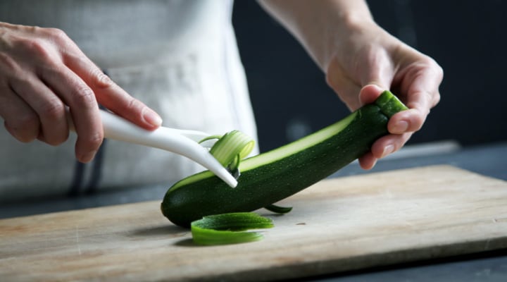 Image of Person Peeling Vegetable