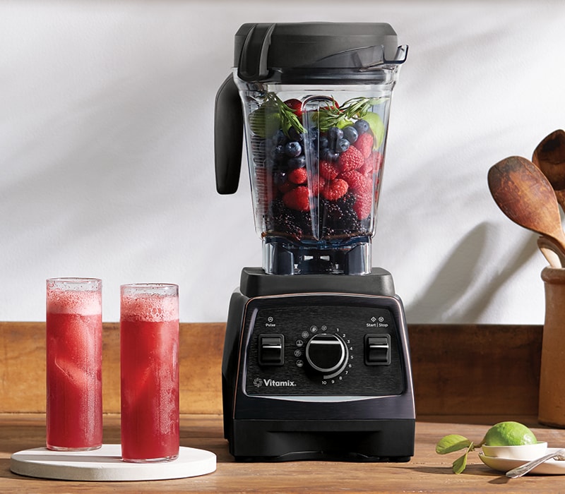 professional series 750 shown on a counter with fruit in the container and 2 smoothie glasses