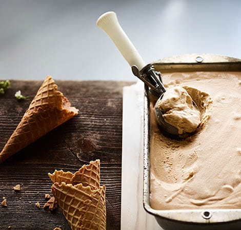 cloudberry ice cream being scooped