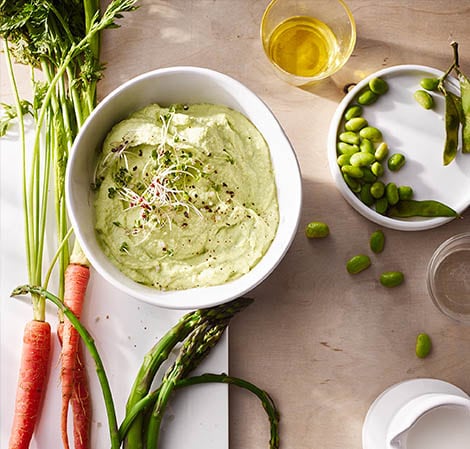 edamame dip in a bowl with vegetables
