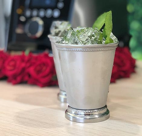 Mint Julep V3 in a glass cup featuring Aer Disc