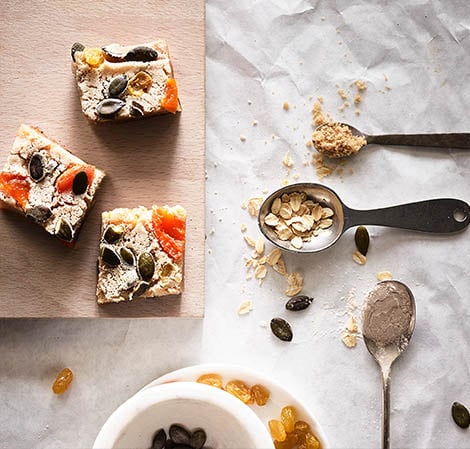 oatmeal cake on a wooden cutting board with ingredients