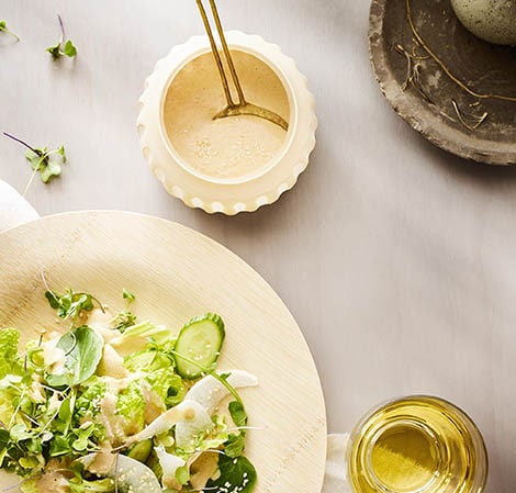 sesame dressing in a jar with a salad