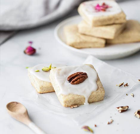 soft sugar cookies on a plate with a napkin in the background