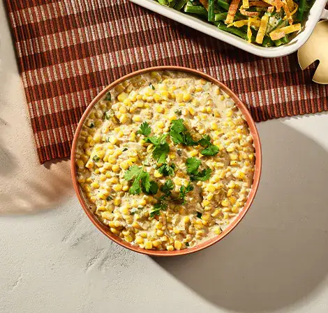 Maíz crema estilo elote con cangrejo